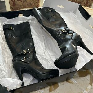 Brand new black Guess high heeled boot with gold accents buckles